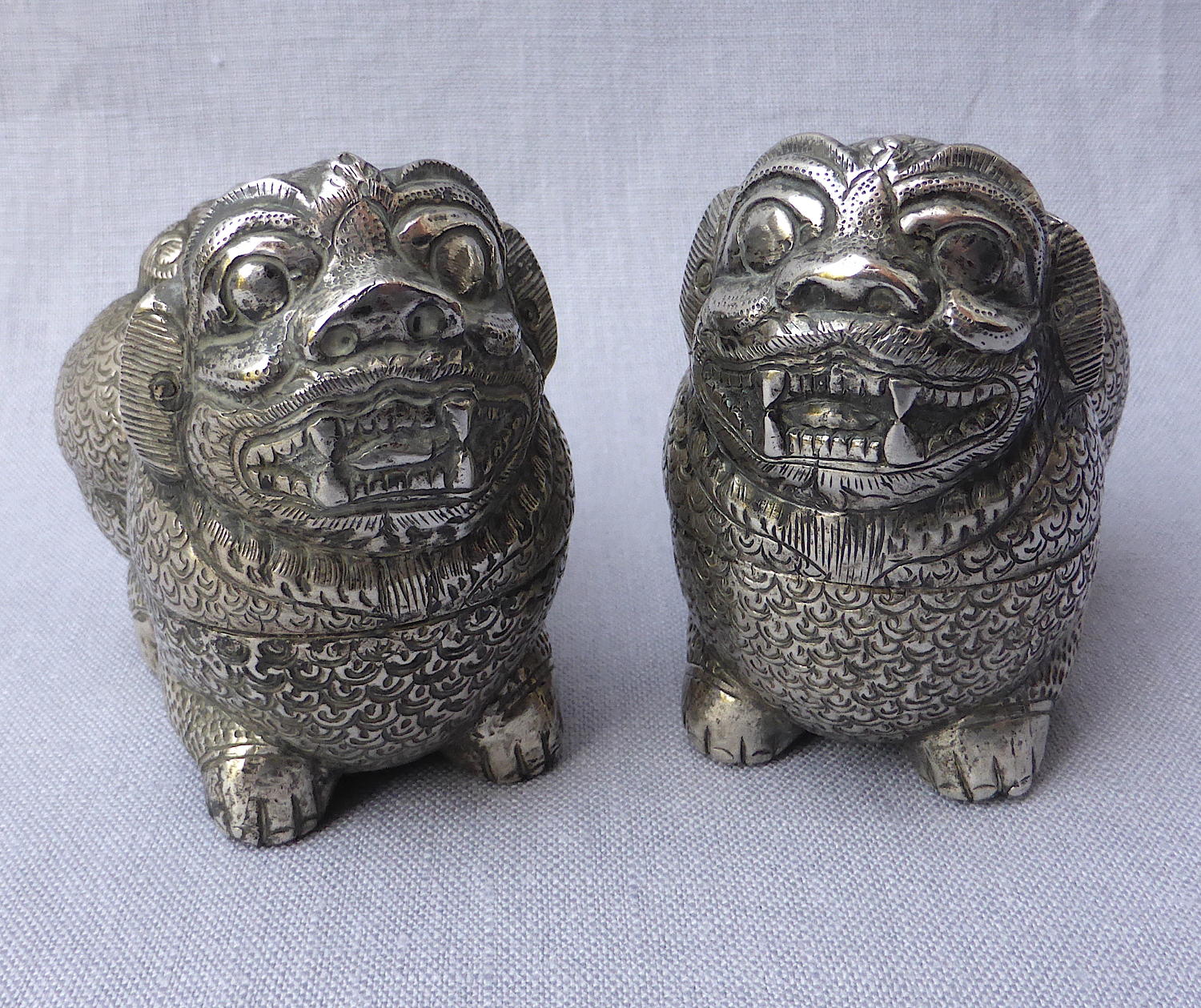 Pair of Cambodian silver Foo lion dog betel nut boxes