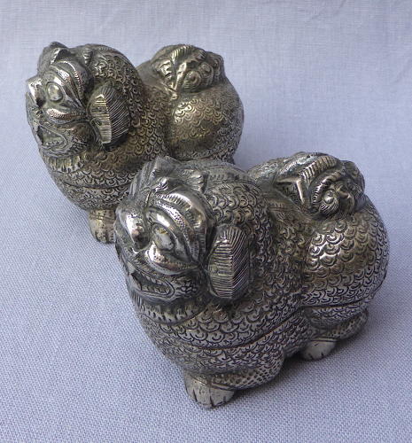 Pair of Cambodian silver Foo lion dog betel nut boxes