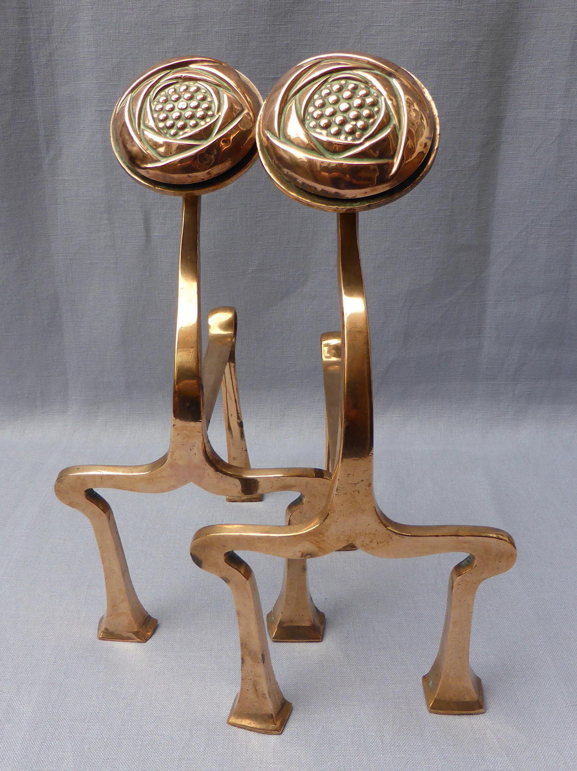Fine pair of Arts & Crafts style copper fire dogs