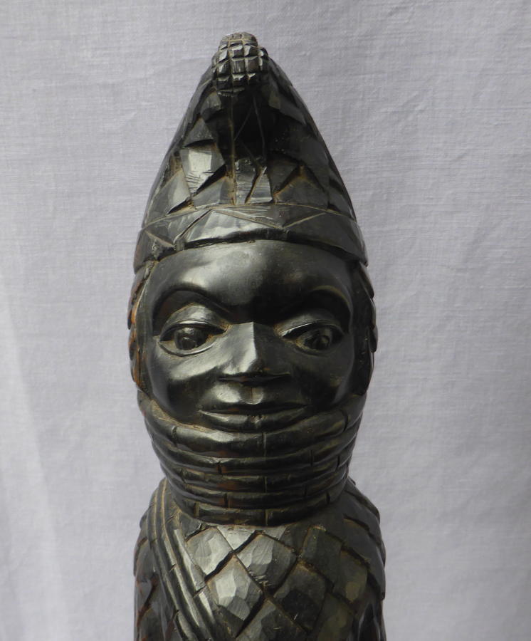 Carved ebony tribal figure of the Benin Oba of Nigeria