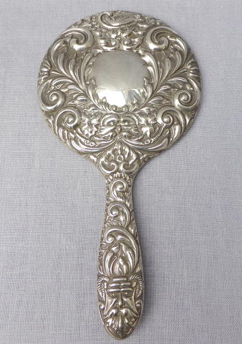 Repoussé silver hand mirror by Broadway & Co 1982