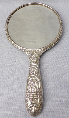 Repoussé silver hand mirror by Broadway & Co 1982
