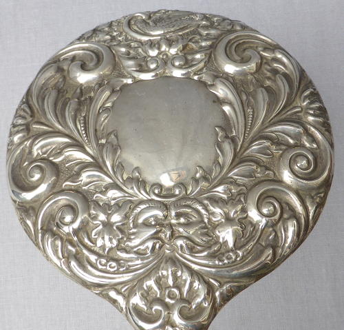 Repoussé silver hand mirror by Broadway & Co 1982