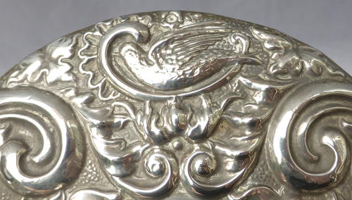Repoussé silver hand mirror by Broadway & Co 1982