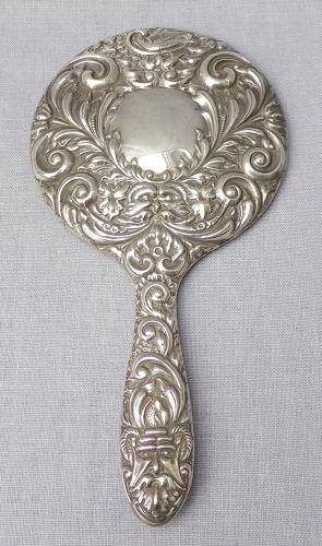 Repoussé silver hand mirror by Broadway & Co 1982