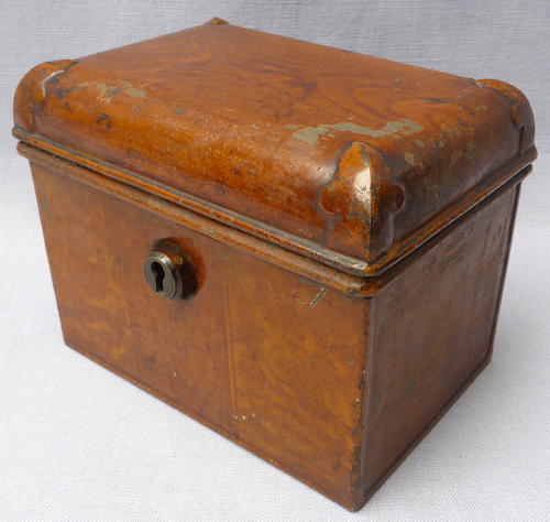 Doll's miniature tin trunk with wood grain finish