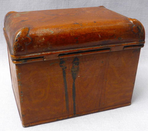 Doll's miniature tin trunk with wood grain finish