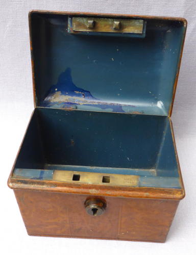 Doll's miniature tin trunk with wood grain finish