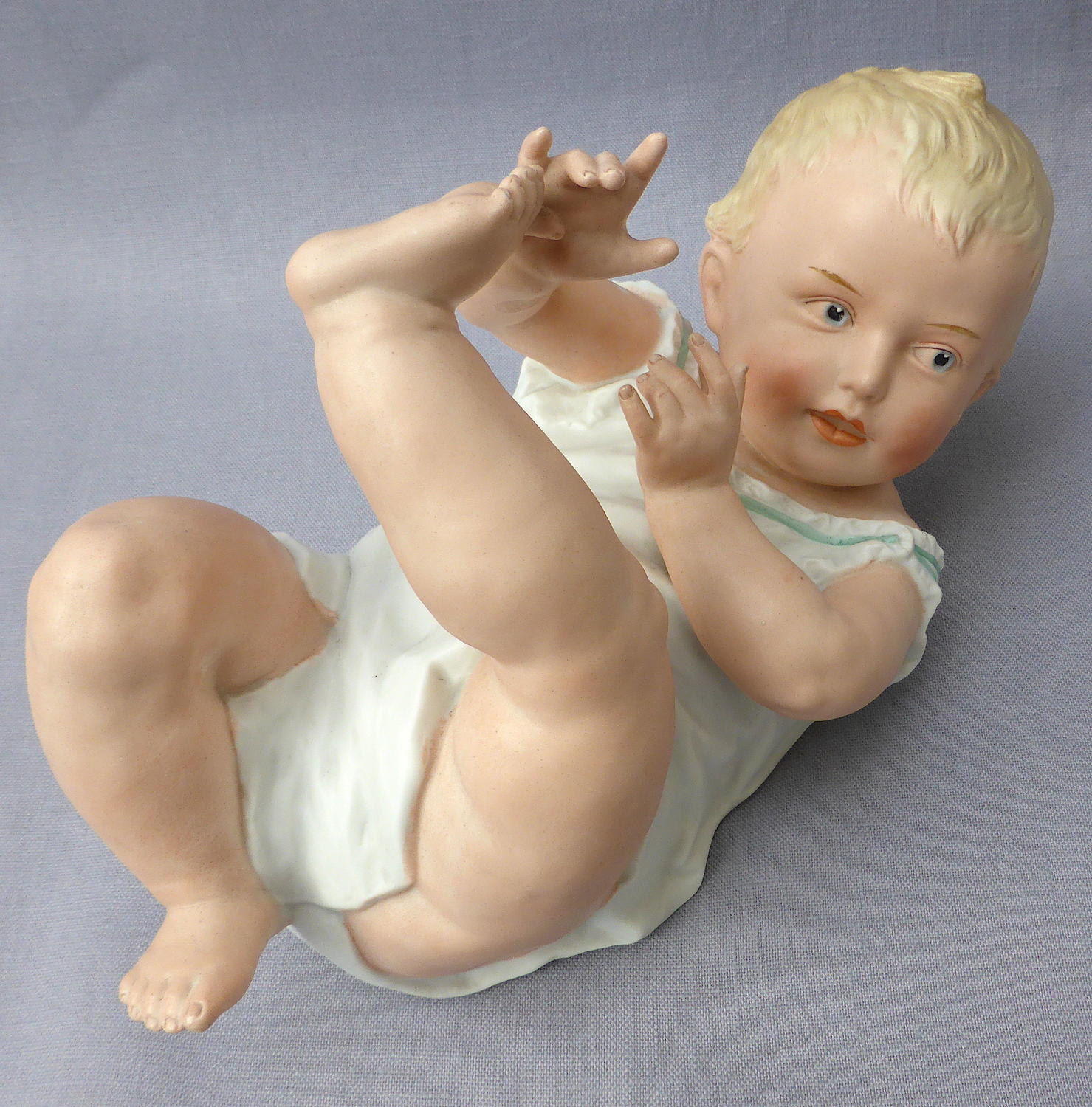 Large Heubach bisque porcelain piano baby