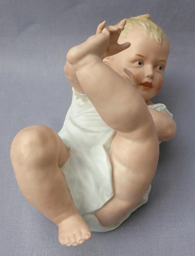 Large Heubach bisque porcelain piano baby