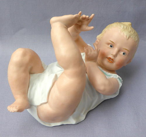 Large Heubach bisque porcelain piano baby