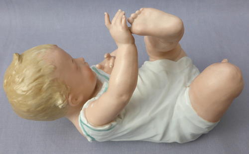 Large Heubach bisque porcelain piano baby