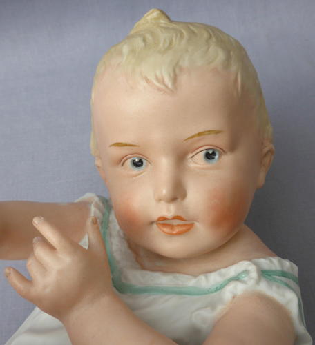 Large Heubach bisque porcelain piano baby