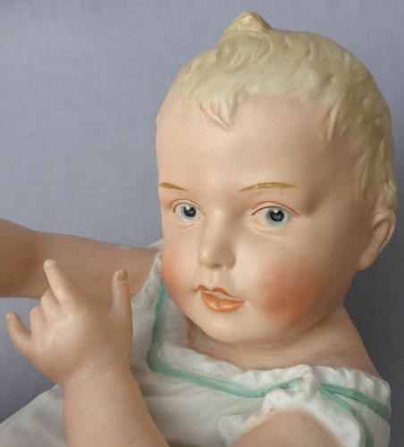 Large Heubach bisque porcelain piano baby
