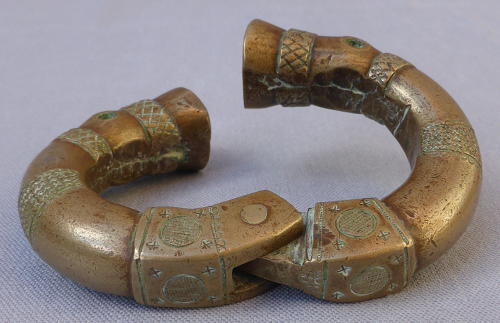 Four 19th century bronze manilla slave currency bracelets