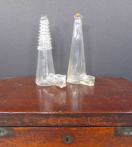 Pair of glass caged bird feeders