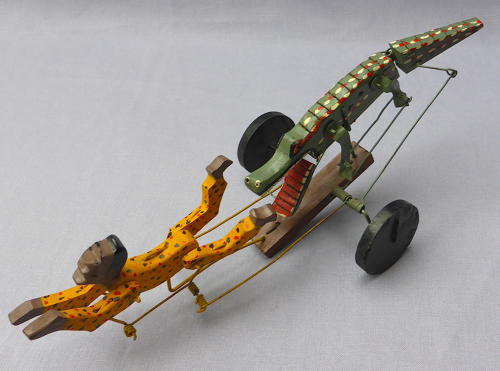 Folk art swimmer & crocodile automaton toy