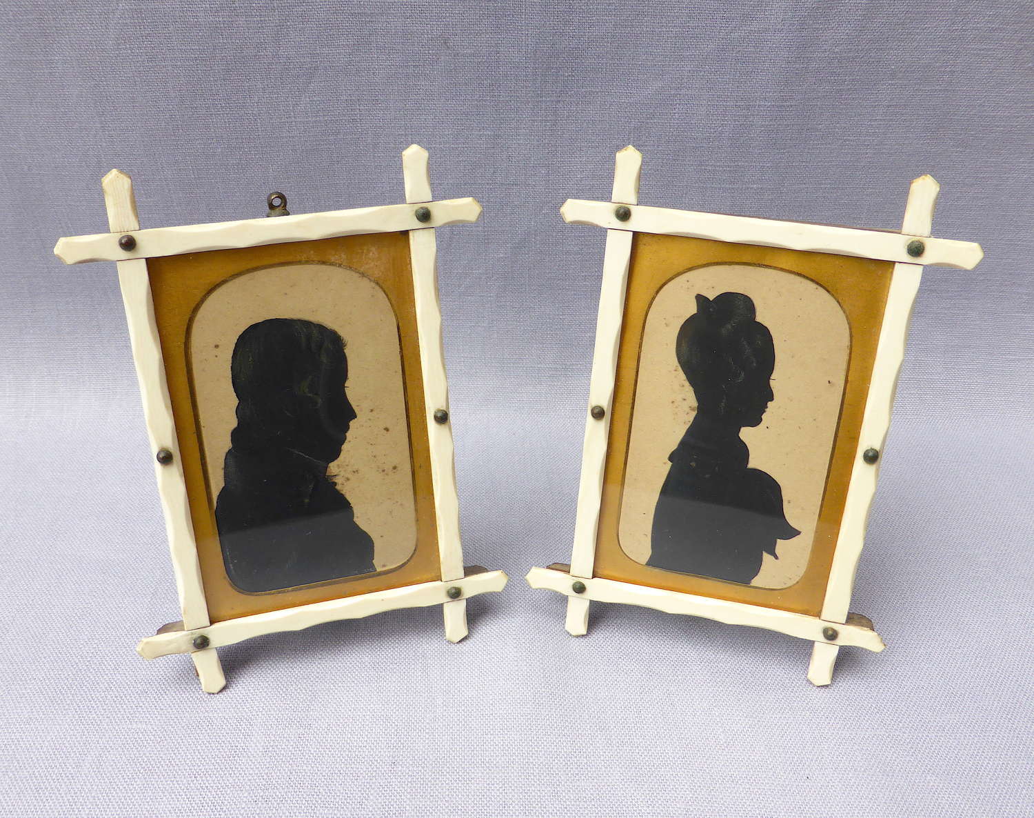 Pair of early 19thC miniature silhouette portraits