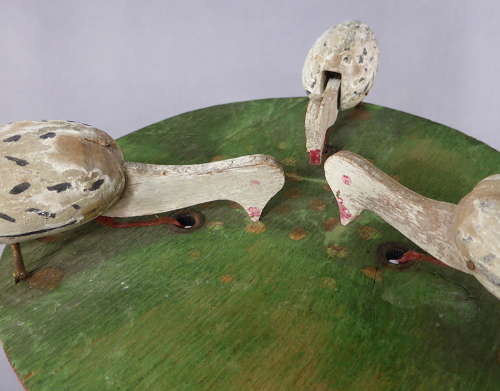 Pecking geese toy
