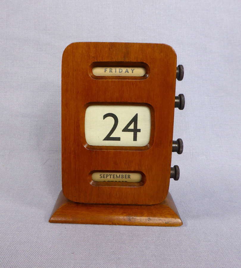 Perpetual roller desk calendar