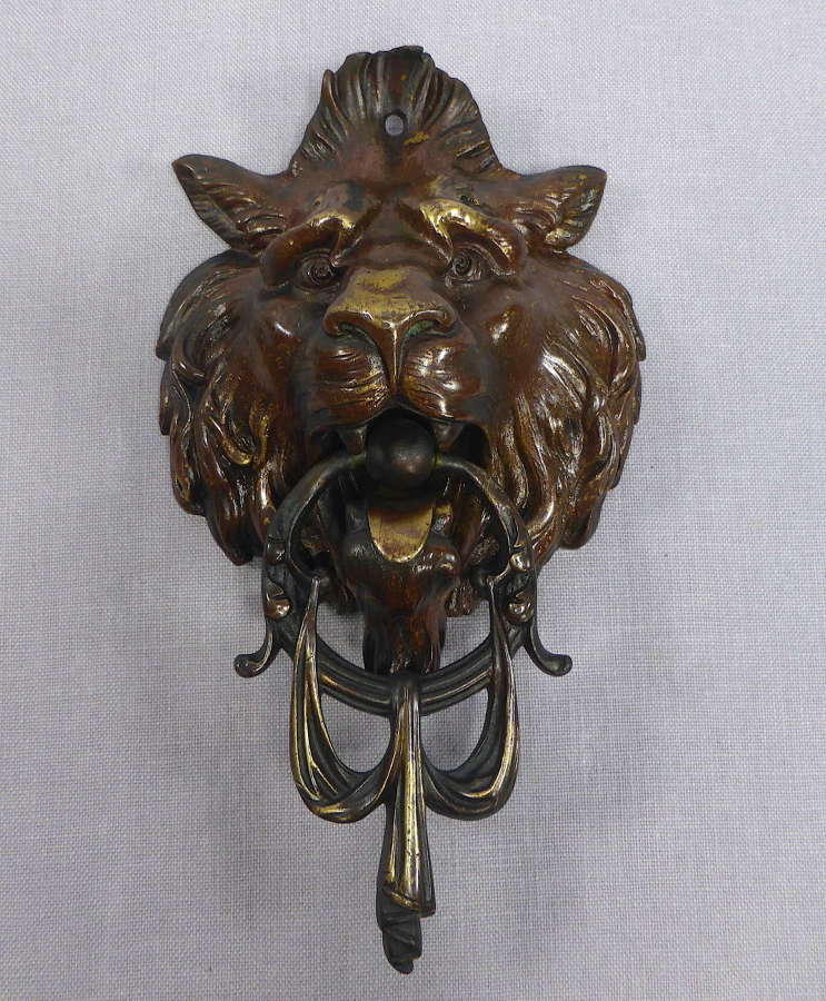 Lion's head door knocker