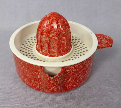 Mottled red Bakelite juicer