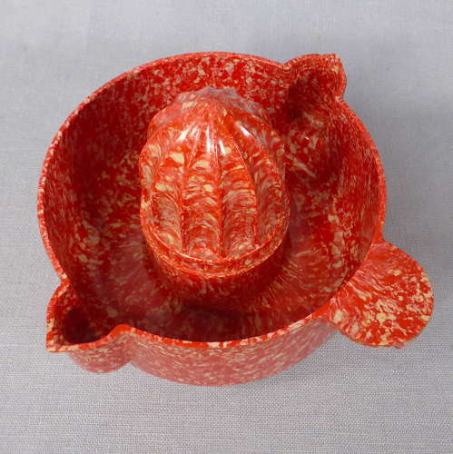 Mottled red Bakelite juicer