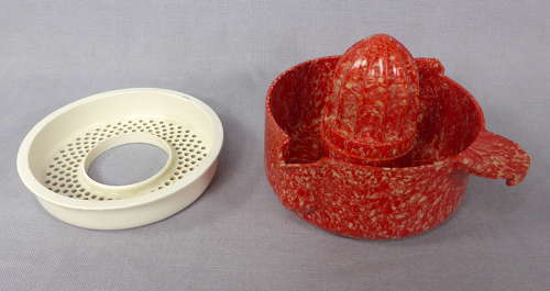 Mottled red Bakelite juicer