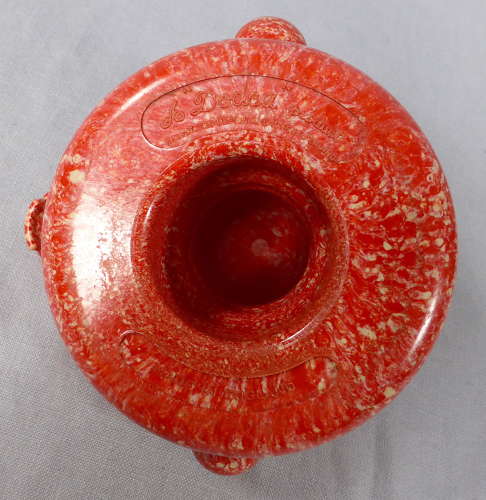 Mottled red Bakelite juicer